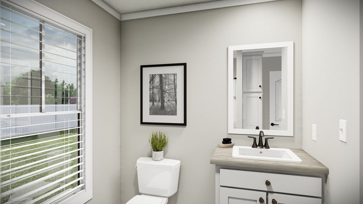 The THE WASHINGTON Guest Bathroom. This Manufactured Mobile Home features 3 bedrooms and 2 baths.