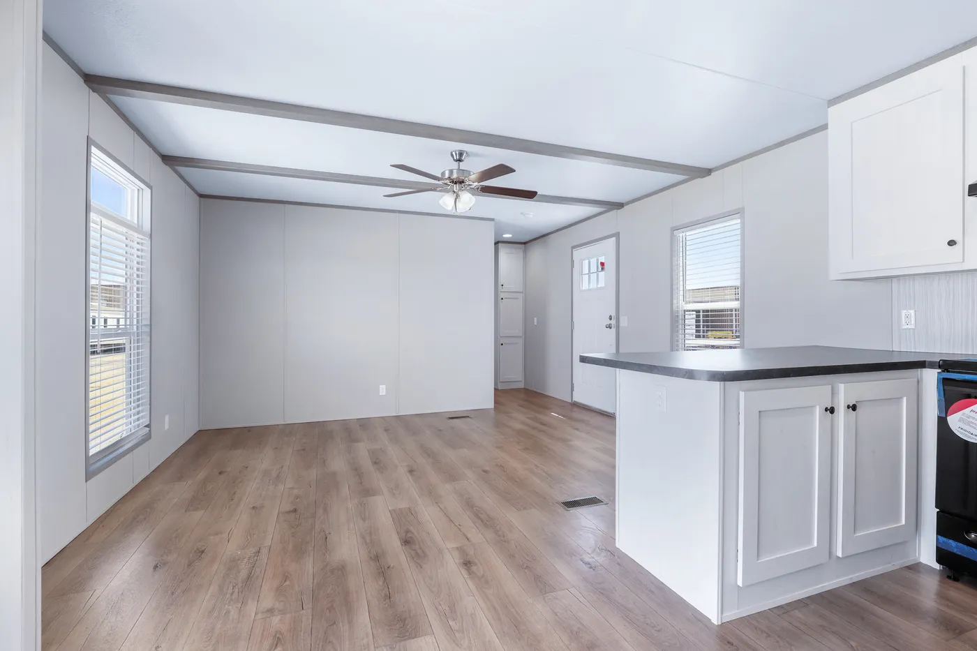 The ANNIVERSARY 16602A Living Room. This Manufactured Mobile Home features 2 bedrooms and 2 baths.