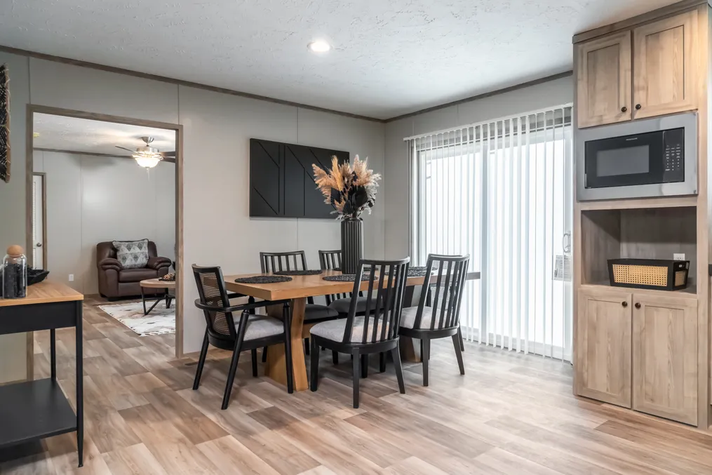 The TRADITION 72 Dining Room. This Manufactured Mobile Home features 4 bedrooms and 2 baths.