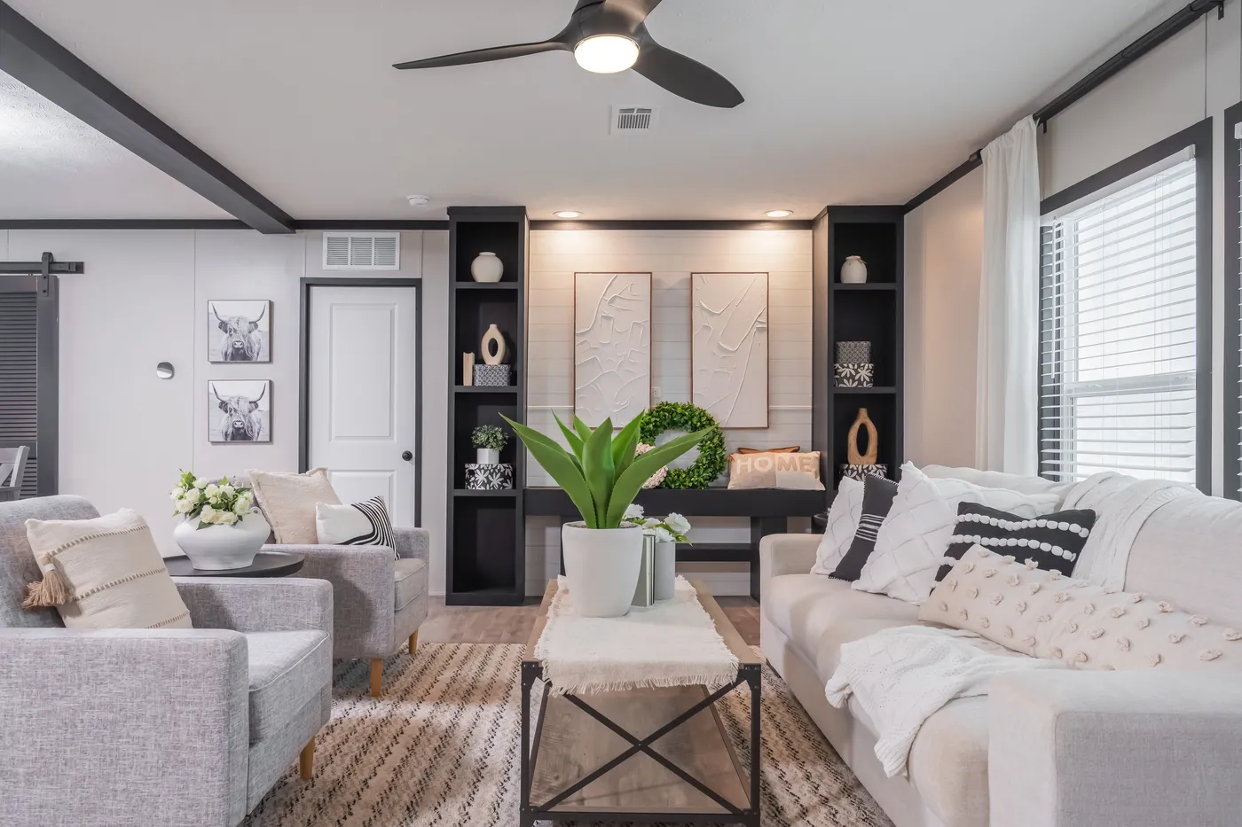 The CRAZY EIGHTS Living Room. This Manufactured Mobile Home features 4 bedrooms and 2 baths.