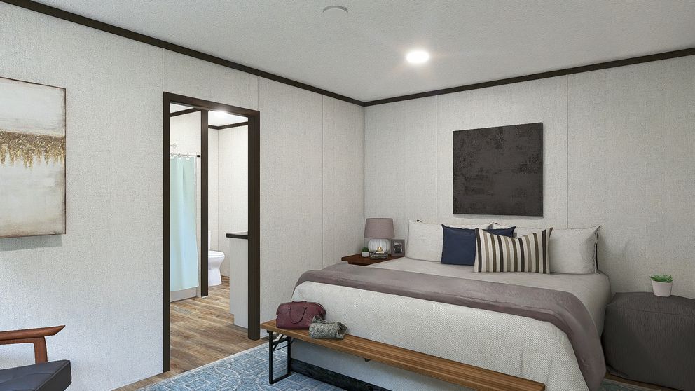 The DYNAMIC Primary Bedroom. This Manufactured Mobile Home features 3 bedrooms and 2 baths.