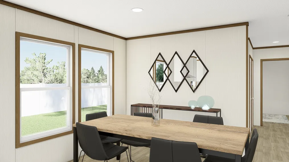 The OCCASSION Dining Area. This Manufactured Mobile Home features 4 bedrooms and 2 baths.