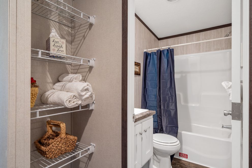 The GARNET Guest Bathroom. This Manufactured Mobile Home features 3 bedrooms and 2 baths.