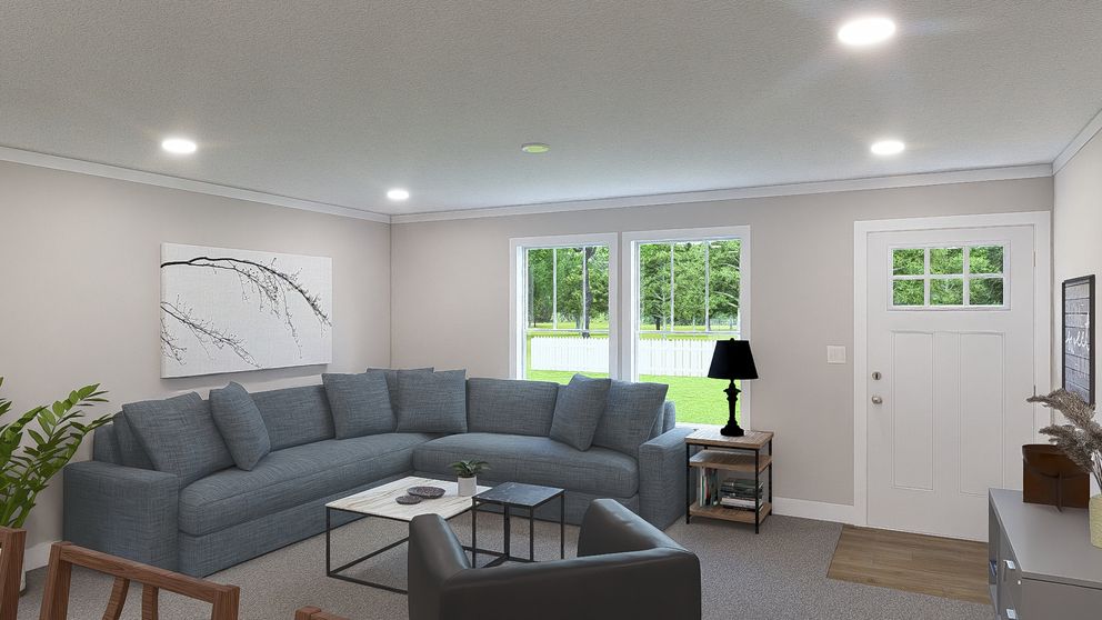 The BROWN EYED GIRL Living Room. This Manufactured Mobile Home features 4 bedrooms and 2 baths.