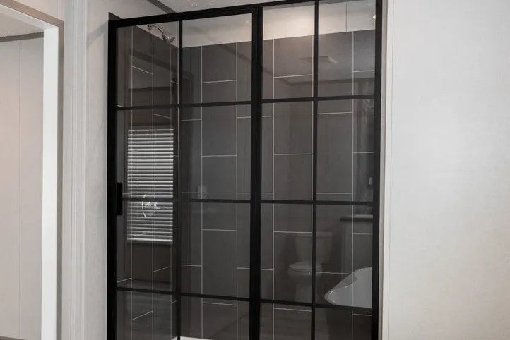 The PLATINUM ANNIVERSARY Primary Bathroom. This Manufactured Mobile Home features 3 bedrooms and 2 baths.