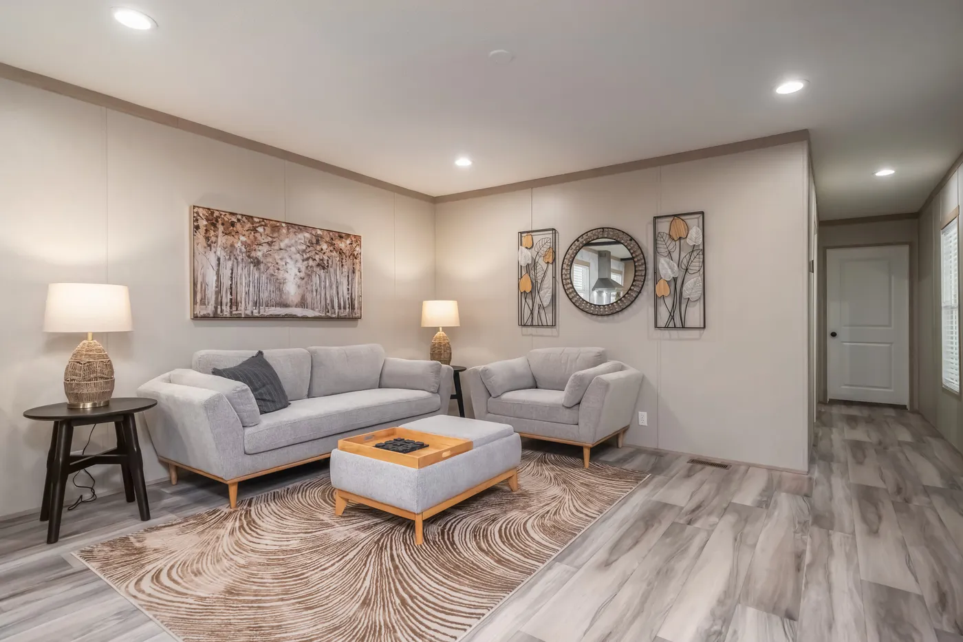 The ANNIVERSARY JEWEL Living Room. This Manufactured Mobile Home features 3 bedrooms and 2 baths.
