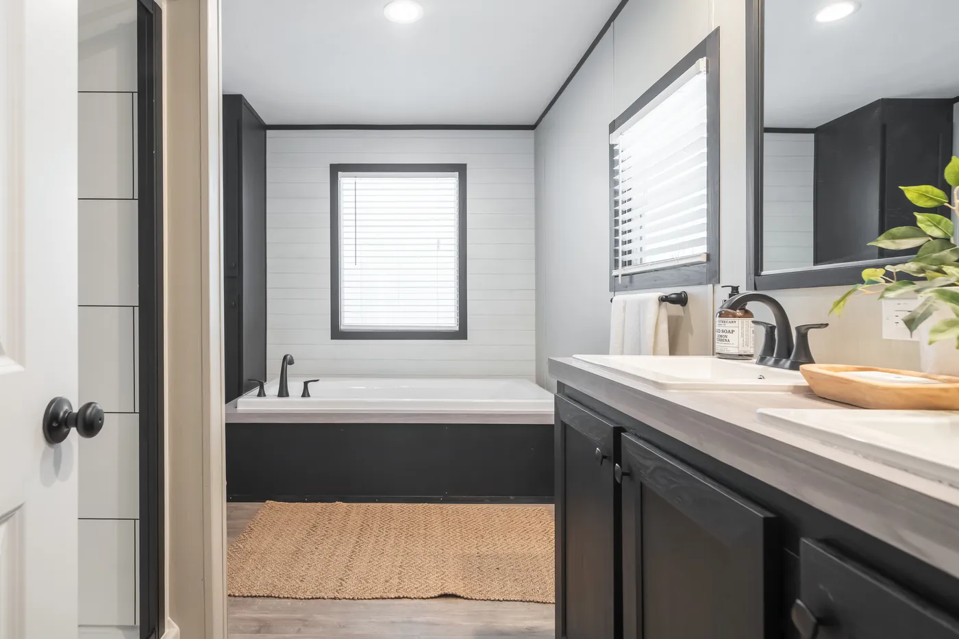 The CRAZY EIGHTS Primary Bathroom. This Manufactured Mobile Home features 4 bedrooms and 2 baths.