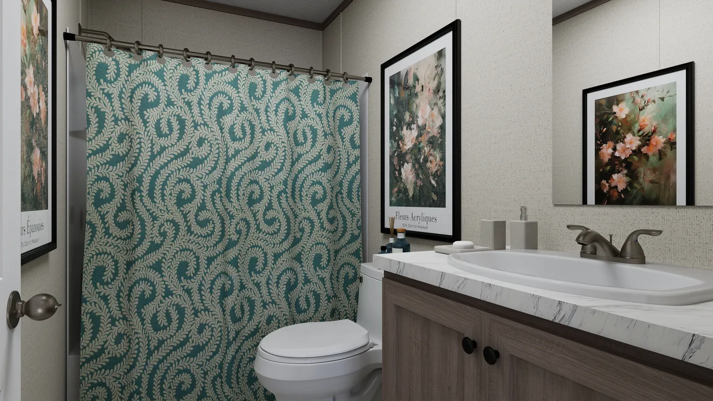 The THE MOUNTAINEER 60 Guest Bathroom. This Manufactured Mobile Home features 3 bedrooms and 2 baths.
