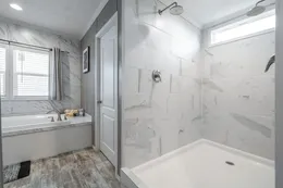 The CASCADE Primary Bathroom. This Manufactured Mobile Home features 4 bedrooms and 2 baths.