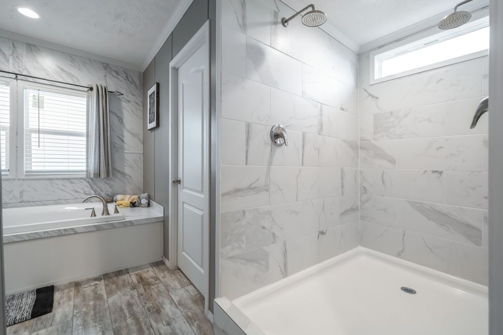 The CASCADE Primary Bathroom. This Manufactured Mobile Home features 4 bedrooms and 2 baths.