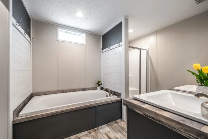 The ANNIVERSARY CHOICE Primary Bathroom. This Manufactured Mobile Home features 3 bedrooms and 2 baths.