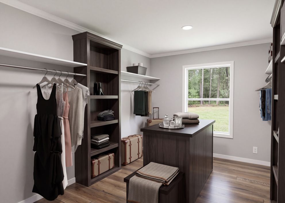 The THE ROOSEVELT Primary Bedroom Closet. This Manufactured Mobile Home features 4 bedrooms and 3 baths.