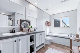 The THE RENEGADE Primary Bathroom. This Manufactured Mobile Home features 3 bedrooms and 2 baths.