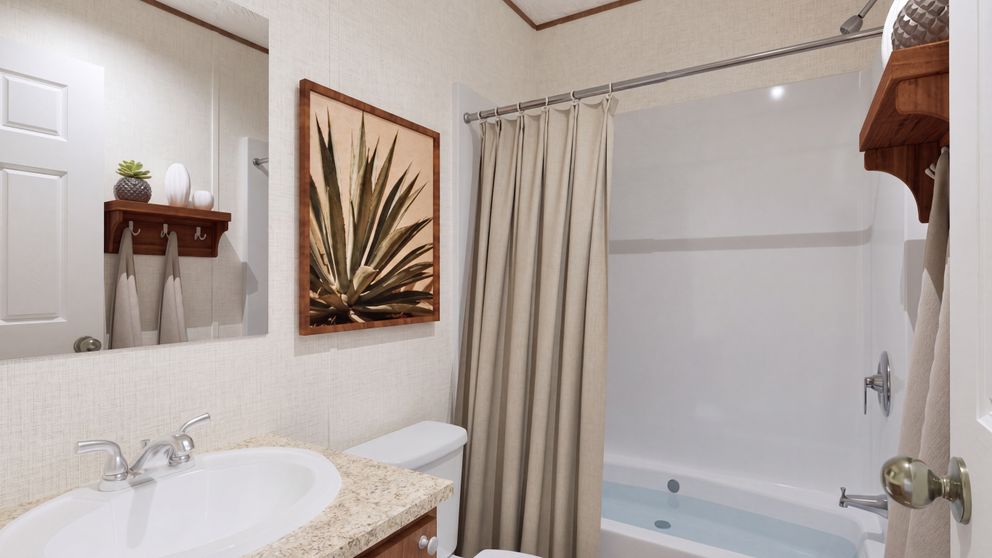 The HICKORY Guest Bathroom. This Manufactured Mobile Home features 3 bedrooms and 2 baths.