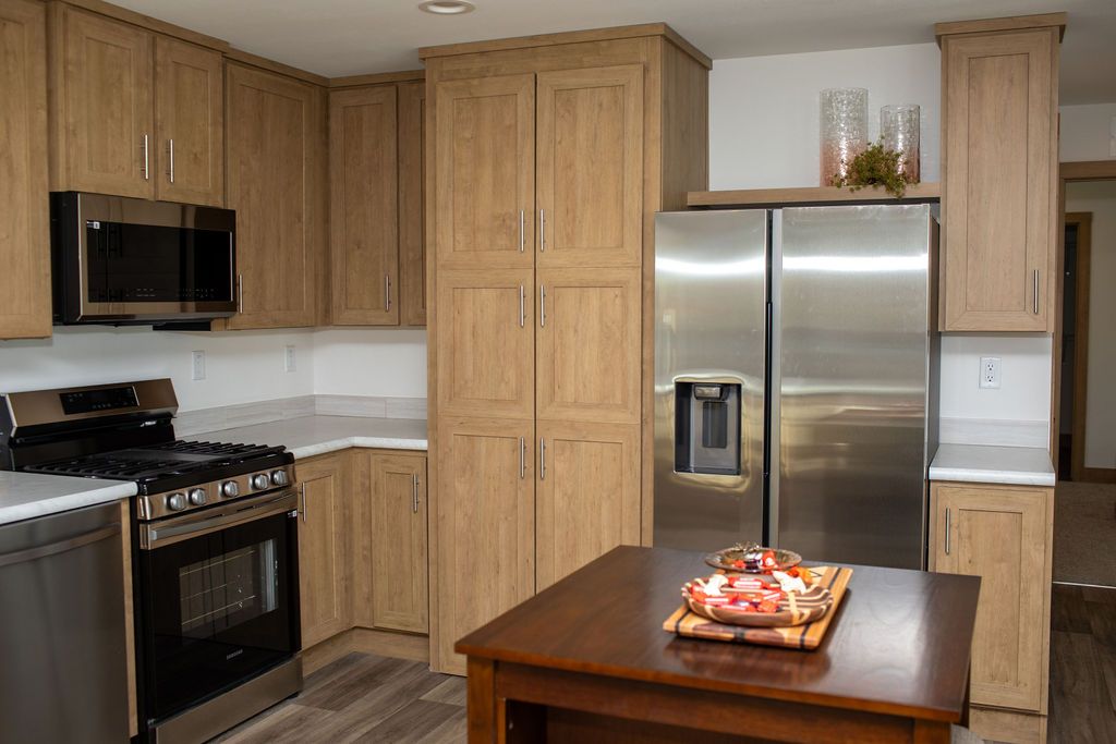 The RAMSEY 223 Kitchen. This Manufactured Mobile Home features 3 bedrooms and 2 baths.