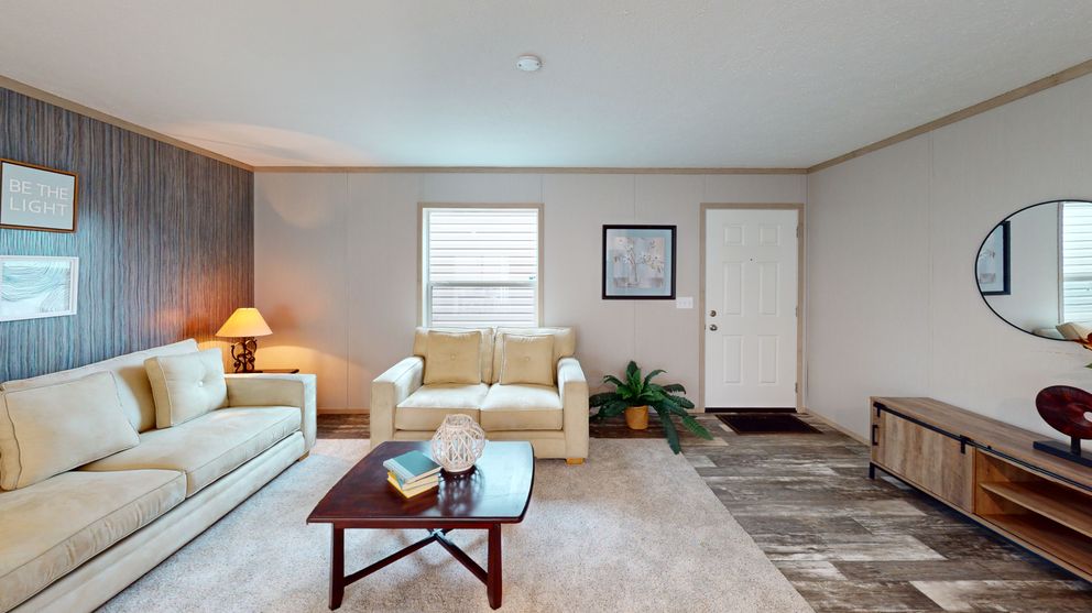 The FRANKLIN Living Room. This Manufactured Mobile Home features 3 bedrooms and 2 baths.
