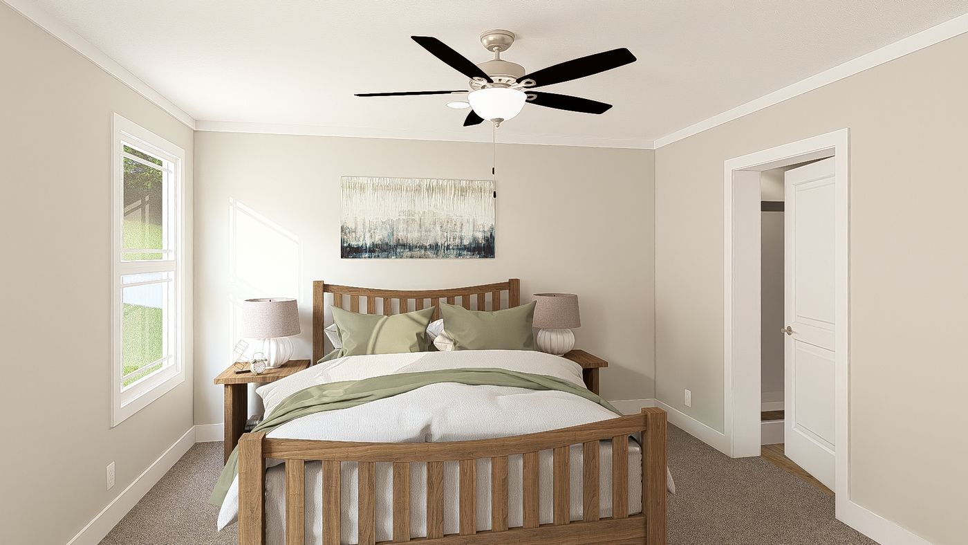 The THE BREEZE 64 Primary Bedroom. This Manufactured Mobile Home features 4 bedrooms and 2 baths.