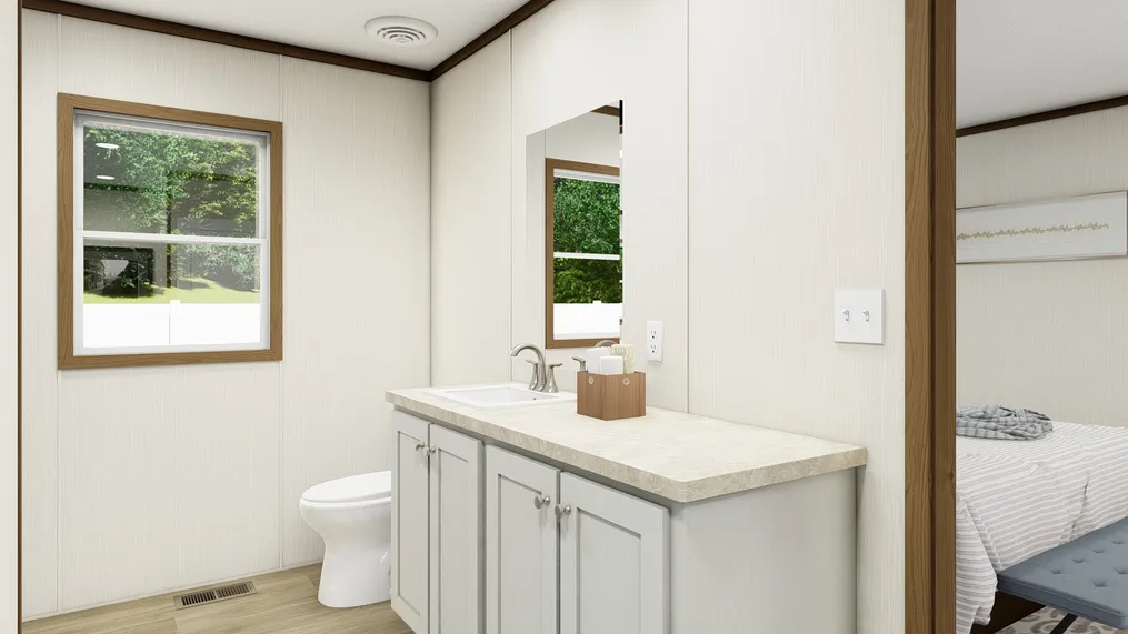 The COLOSSAL Primary Bathroom. This Manufactured Mobile Home features 3 bedrooms and 2 baths.