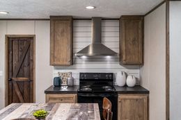 The ANNIVERSARY 56 Exterior. This Manufactured Mobile Home features 3 bedrooms and 2 baths.