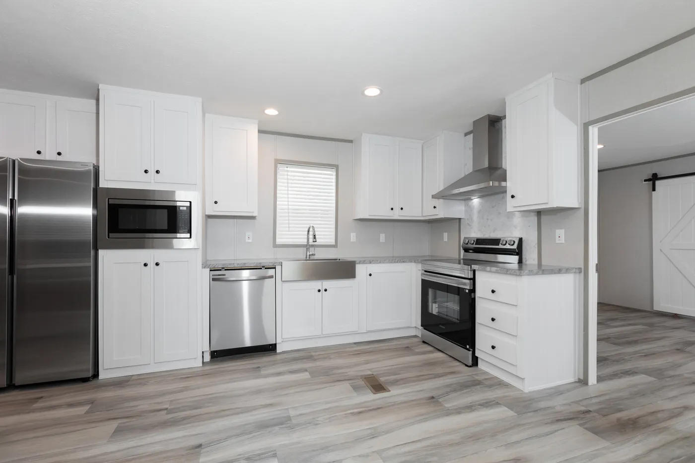 The THE ULTIMATE SHOWER Kitchen. This Manufactured Mobile Home features 3 bedrooms and 2 baths.