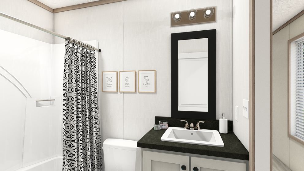 The 7616-4773P THE PULSE Guest Bathroom. This Manufactured Mobile Home features 3 bedrooms and 2 baths.