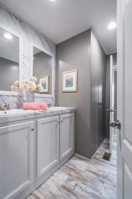 The CASCADE Guest Bathroom. This Manufactured Mobile Home features 4 bedrooms and 2 baths.