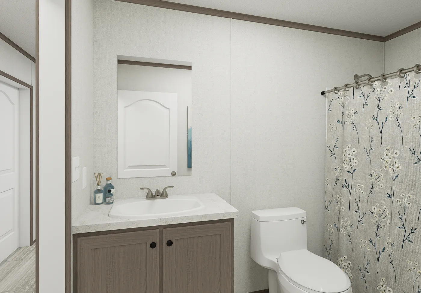 The THE MOUNTAINEER 64 Guest Bathroom. This Manufactured Mobile Home features 3 bedrooms and 2 baths.