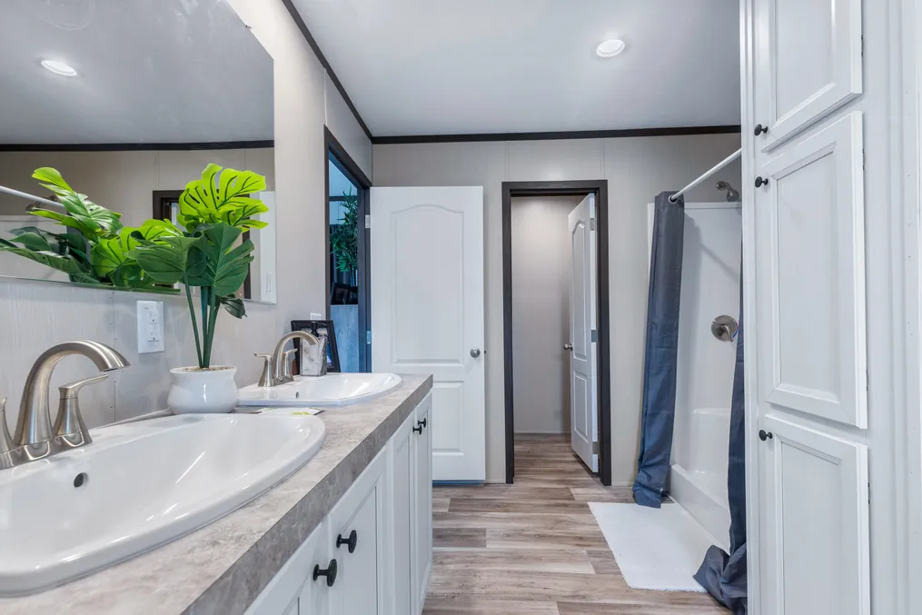 The COLOSSAL Primary Bathroom. This Manufactured Mobile Home features 3 bedrooms and 2 baths.