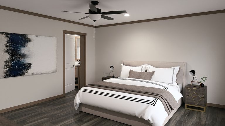 The LIZZIE ELITE Primary Bedroom. This Manufactured Mobile Home features 3 bedrooms and 2 baths.