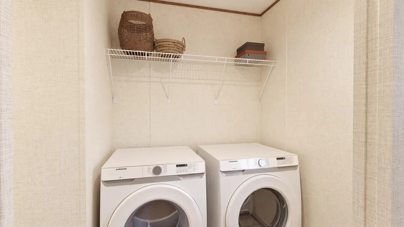 The CEDAR Utility Room. This Manufactured Mobile Home features 3 bedrooms and 2 baths.