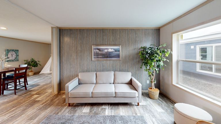The HANCOCK Living Room. This Manufactured Mobile Home features 4 bedrooms and 2 baths.