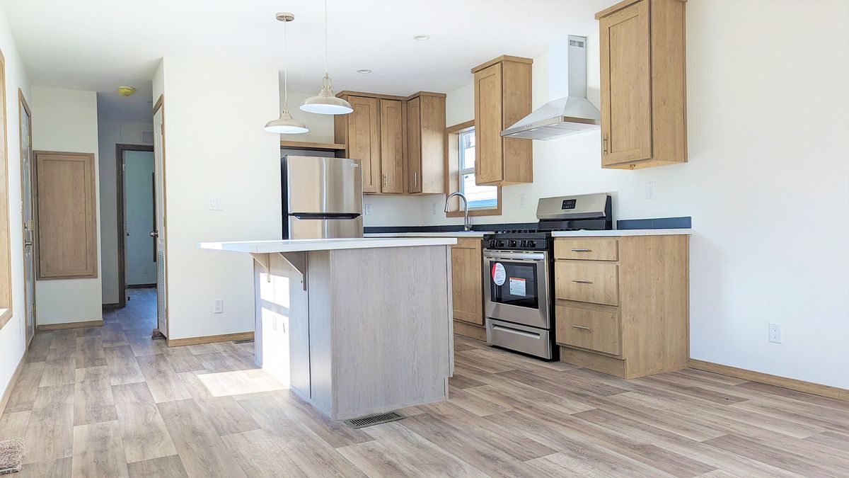 The LIFESTYLE 215 Kitchen. This Manufactured Mobile Home features 1 bedroom and 1 bath.