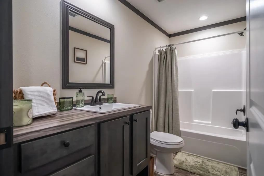 The BABY BOUJEE Guest Bathroom. This Manufactured Mobile Home features 3 bedrooms and 2 baths.