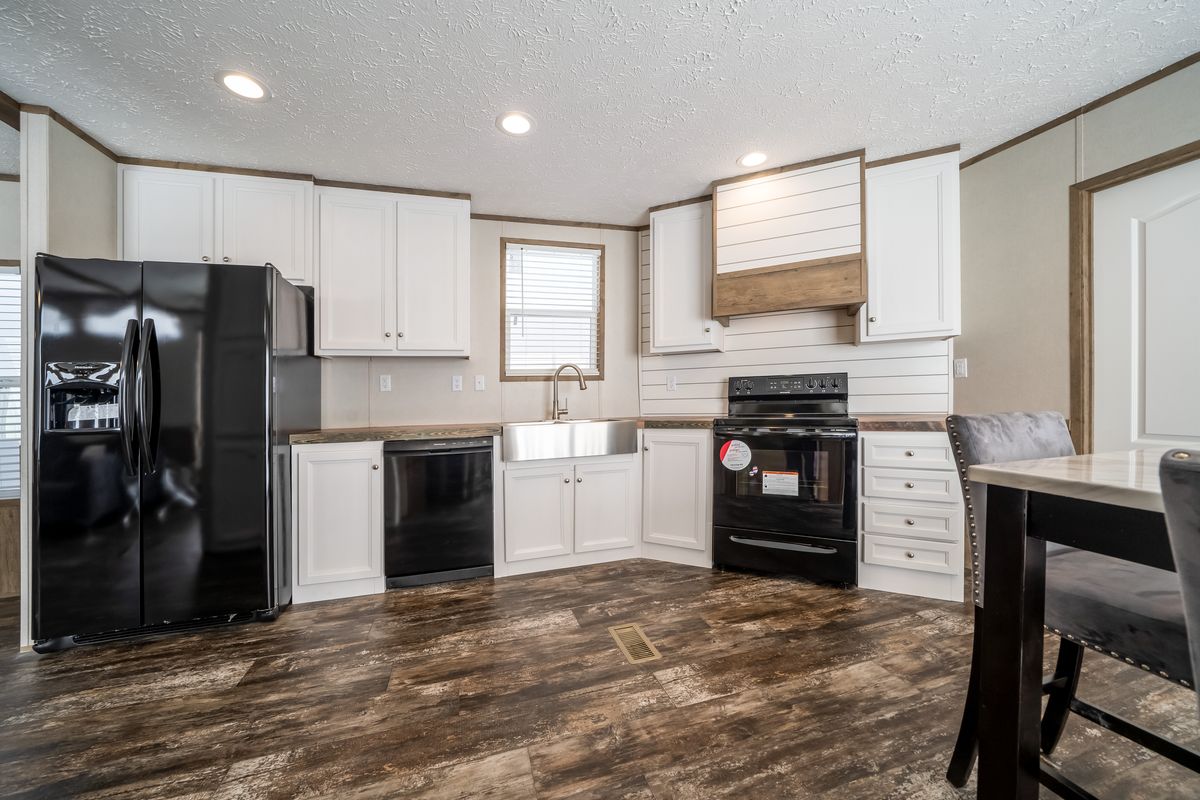 The ANNIVERSARY ENTERTAINER Exterior. This Manufactured Mobile Home features 3 bedrooms and 2 baths.