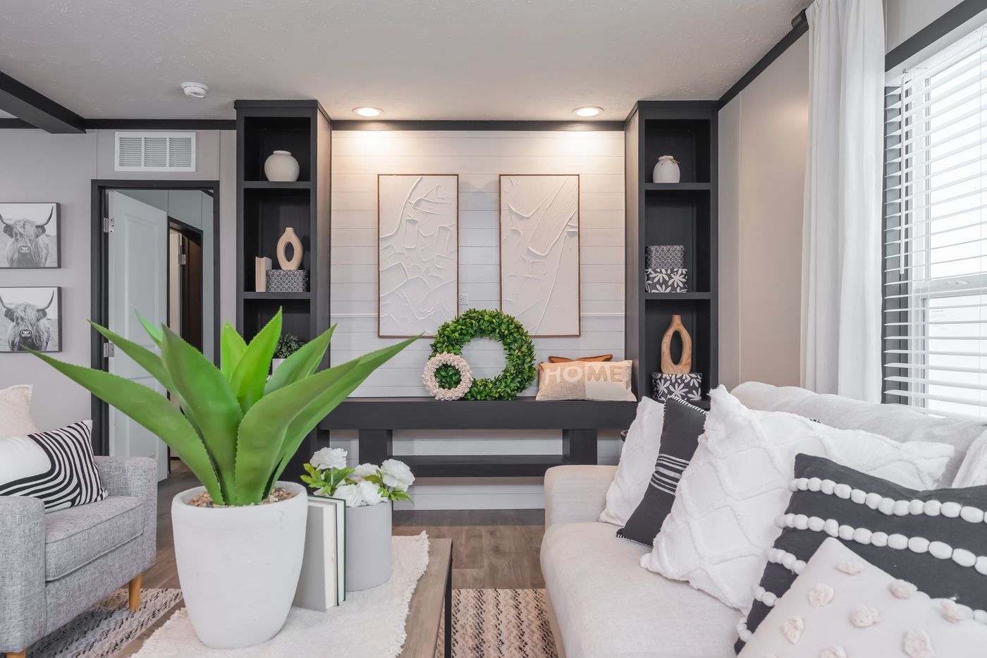 The CRAZY EIGHTS Living Room. This Manufactured Mobile Home features 4 bedrooms and 2 baths.