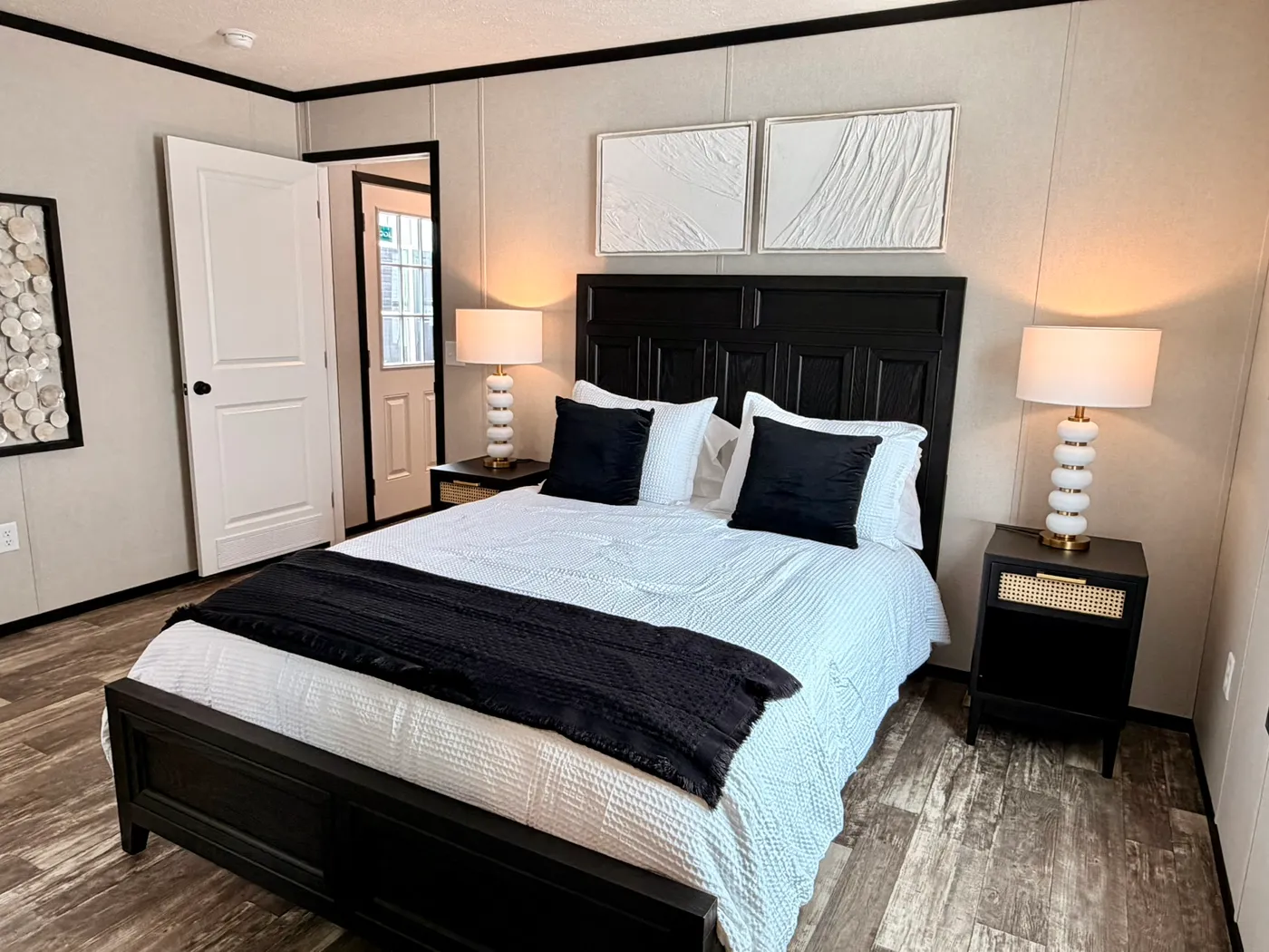 The PEARL Primary Bedroom. This Manufactured Mobile Home features 3 bedrooms and 2 baths.