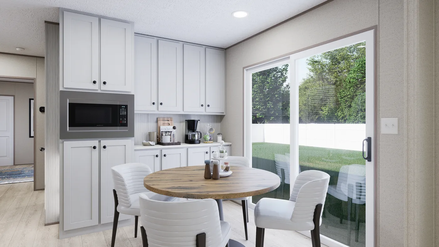 The THE ANNIVERSARY 76 Dining Room. This Manufactured Mobile Home features 3 bedrooms and 2 baths.