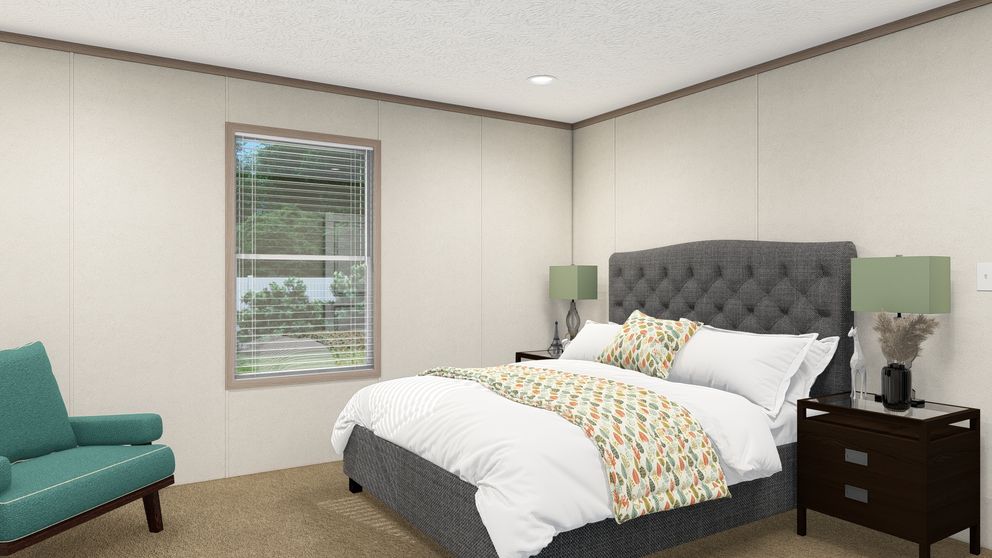 The 4428-E781 THE PULSE Primary Bedroom. This Manufactured Mobile Home features 3 bedrooms and 2 baths.