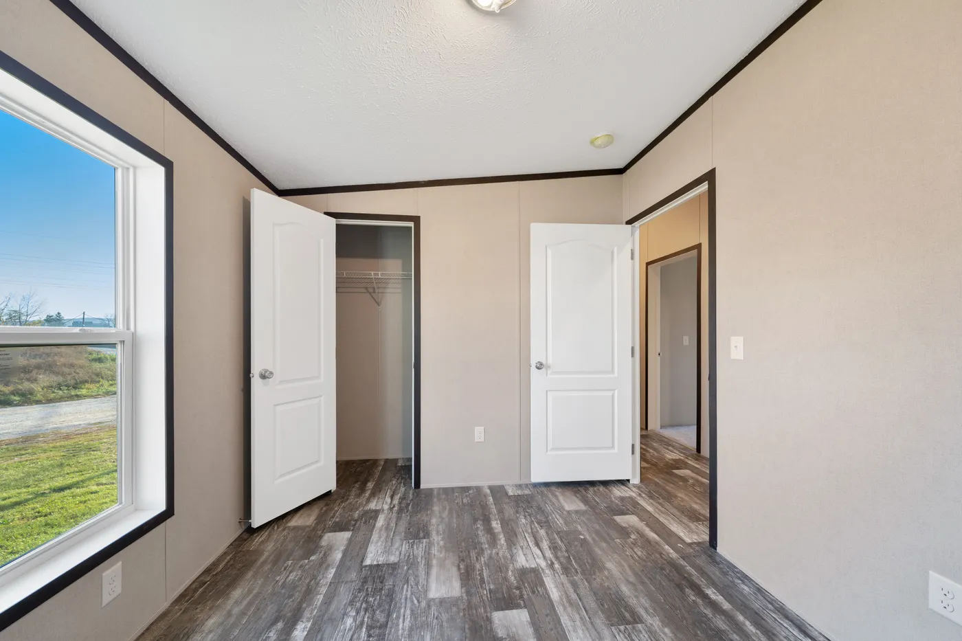 The GARNET Guest Bedroom. This Manufactured Mobile Home features 3 bedrooms and 2 baths.