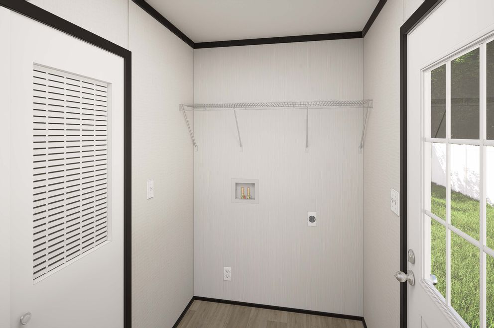 The PLATINUM ANNIVERSARY Utility Room. This Manufactured Mobile Home features 3 bedrooms and 2 baths.