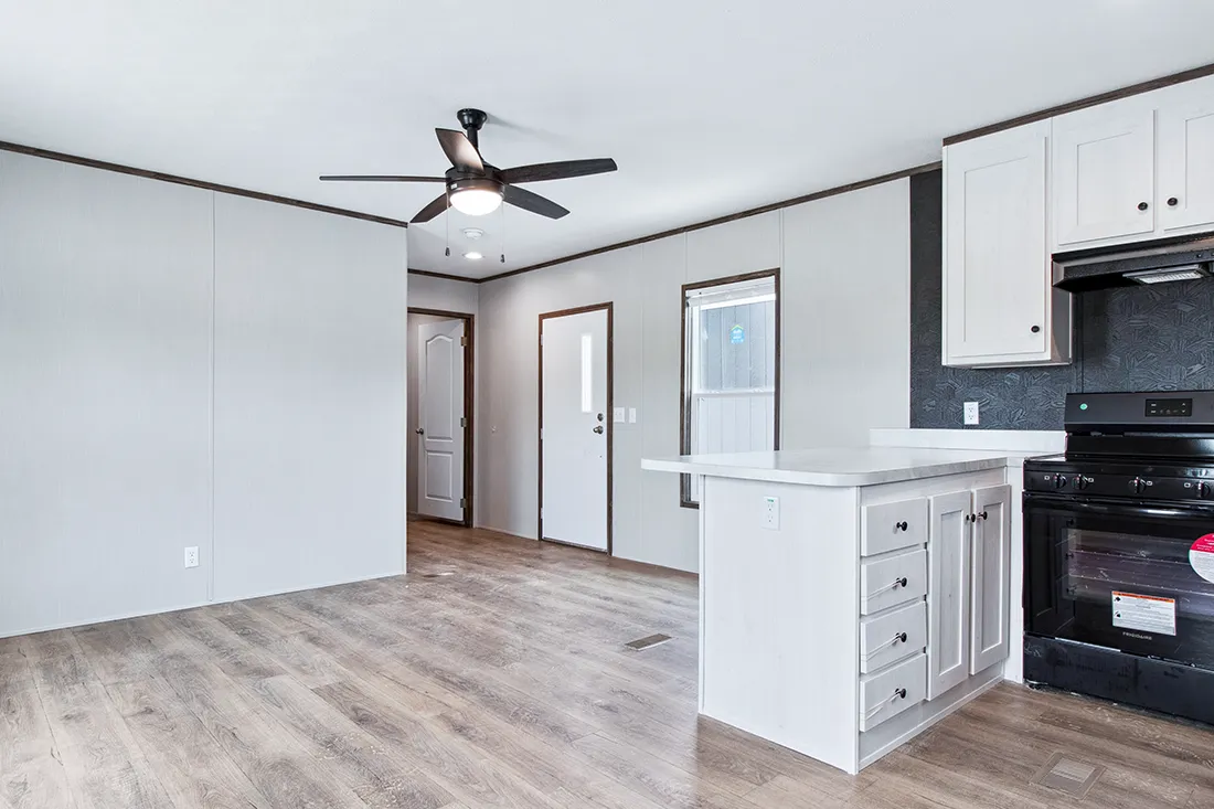The HOMESTEAD 16562A Living Room. This Manufactured Mobile Home features 2 bedrooms and 2 baths.