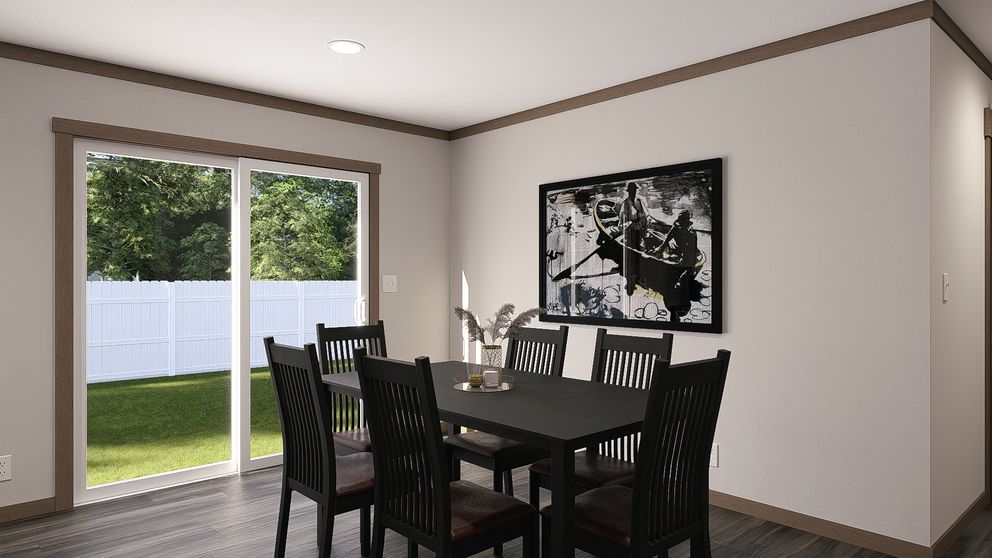 The EVERETT ELITE Dining Room. This Manufactured Mobile Home features 4 bedrooms and 3 baths.