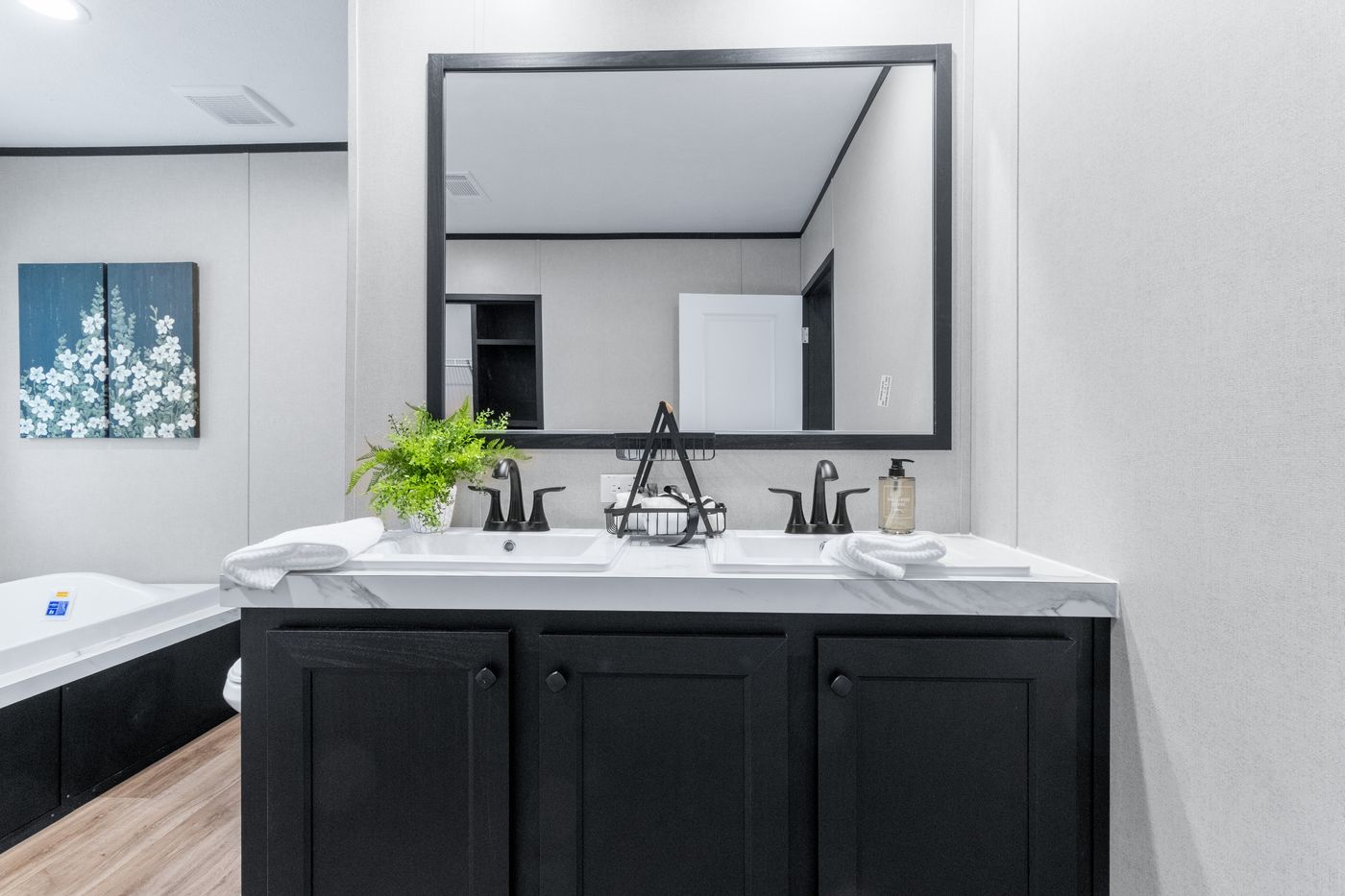 The ABSOLUTE VALUE Primary Bathroom. This Manufactured Mobile Home features 4 bedrooms and 2 baths.
