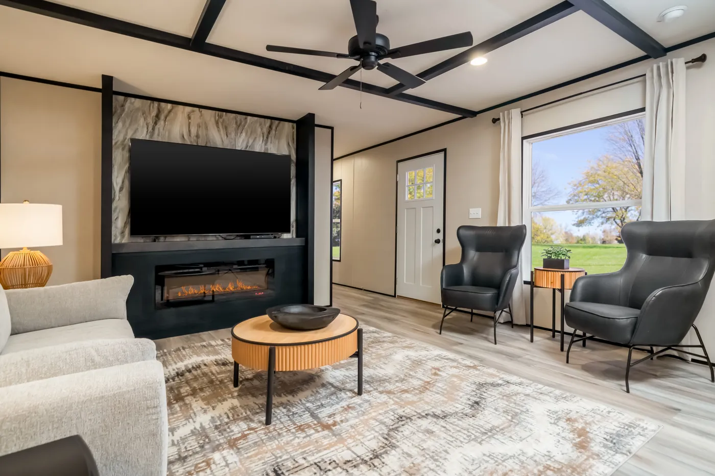 The THE SMOKEY Living Room. This Manufactured Mobile Home features 3 bedrooms and 2 baths.