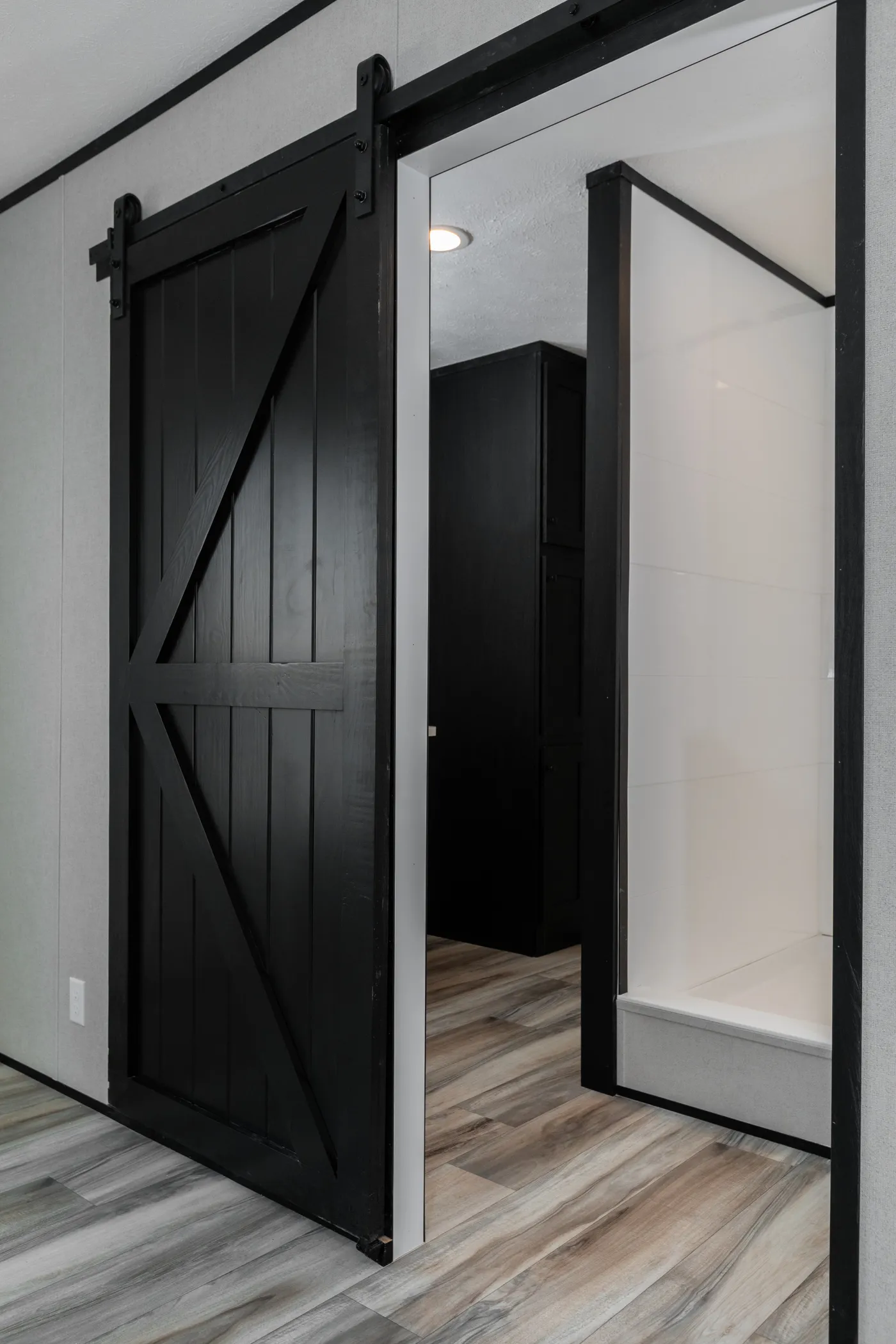 The THE SMOKEY Primary Bedroom. This Manufactured Mobile Home features 3 bedrooms and 2 baths.