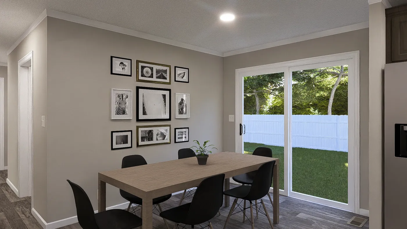 The THE LIL' EASY Dining Area. This Manufactured Mobile Home features 3 bedrooms and 2 baths.