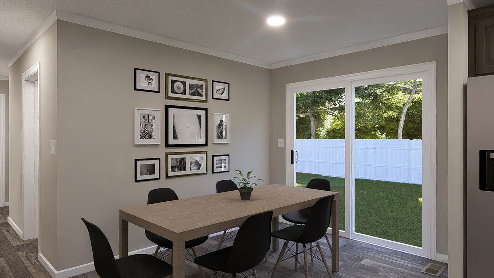 The THE LIL' EASY Dining Area. This Manufactured Mobile Home features 3 bedrooms and 2 baths.