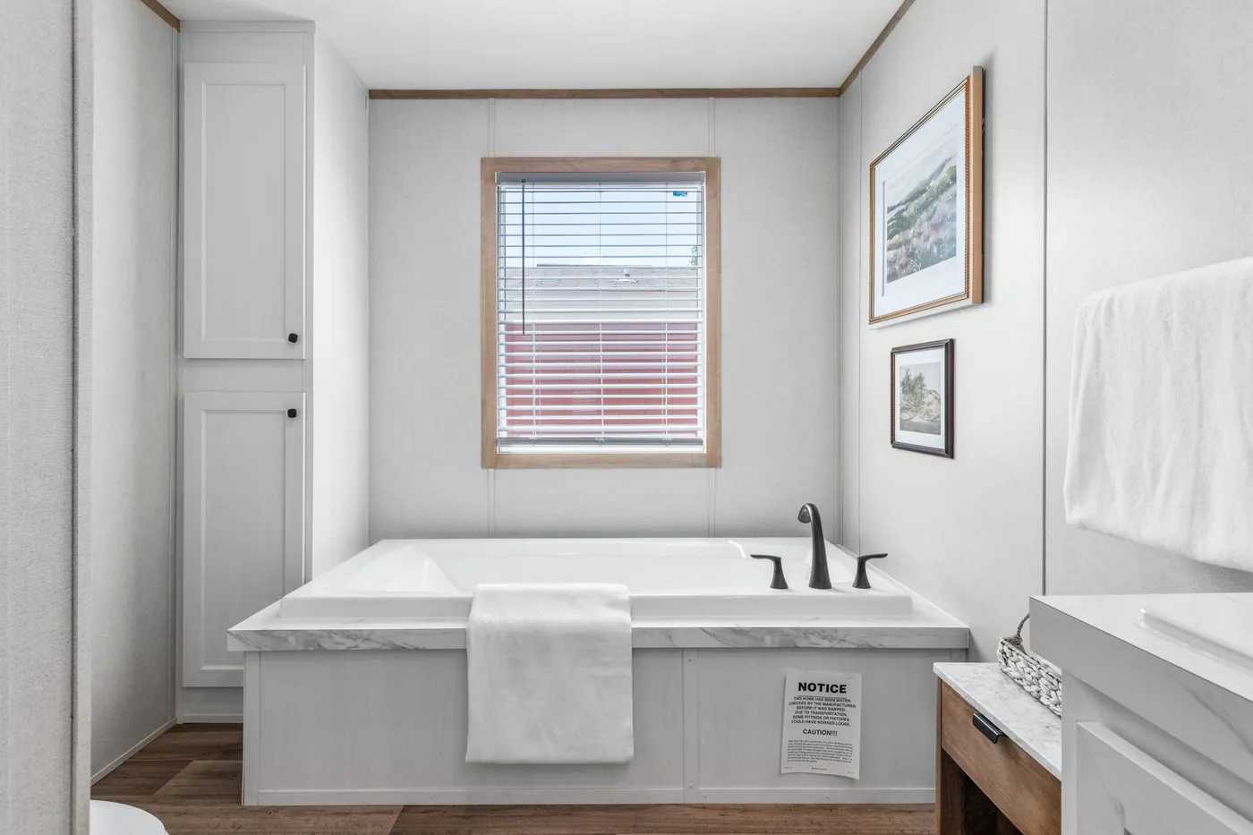 The THE REAL DEAL Primary Bathroom. This Manufactured Mobile Home features 3 bedrooms and 2 baths.