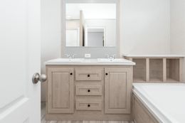 The THE ANNIVERSARY ISLANDER Primary Bathroom. This Manufactured Mobile Home features 3 bedrooms and 2 baths.