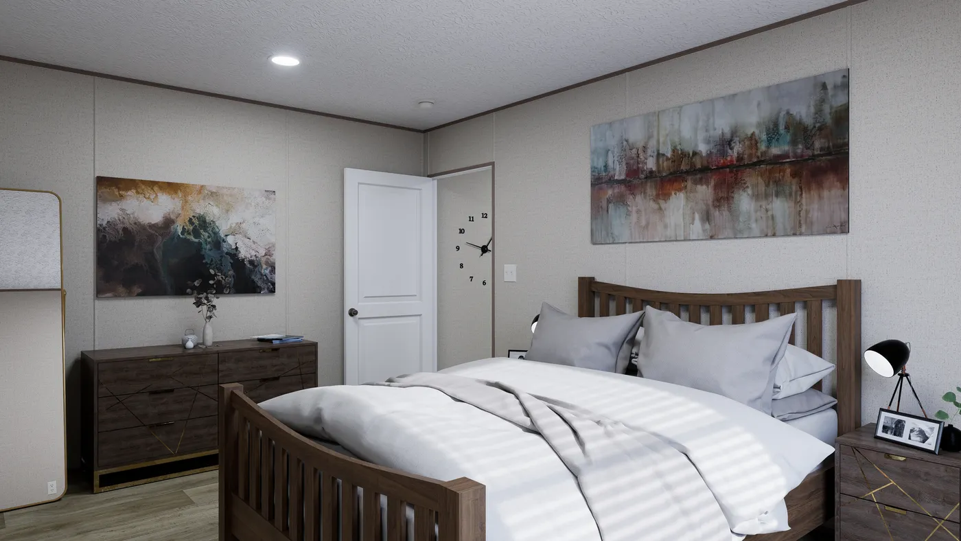 The FOOTHILLS 66 Primary Bedroom. This Manufactured Mobile Home features 3 bedrooms and 2 baths.